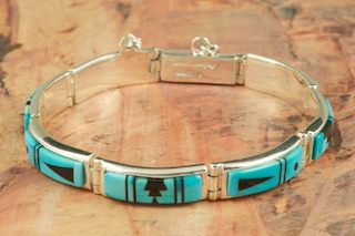 Genuine Sleeping Beauty Turquoise and Black Jade inlaid in Sterling Silver. Stunning Bracelet Designed by Navajo Artist Calvin Begay. Signed by the artist.